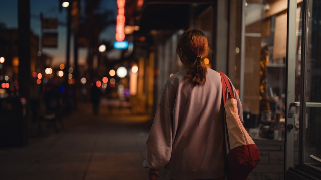 Woman on an evening walk down a quiet neighborhood street