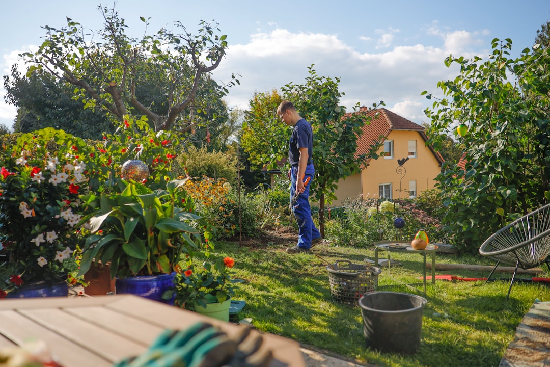 Older woman working in her garden on a sunny day
