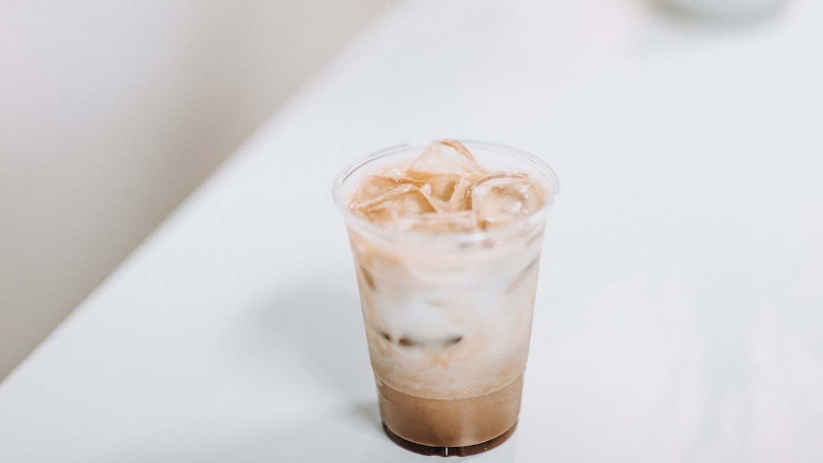 Iced coffee protein smoothie in a clear cup