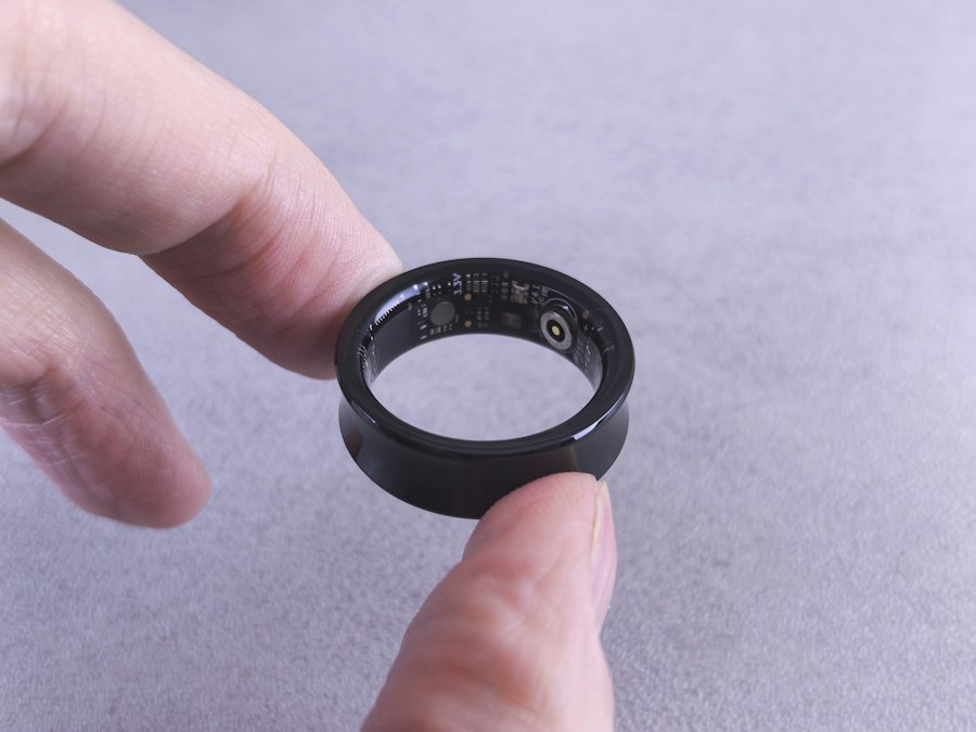 A smart ring held between two fingers